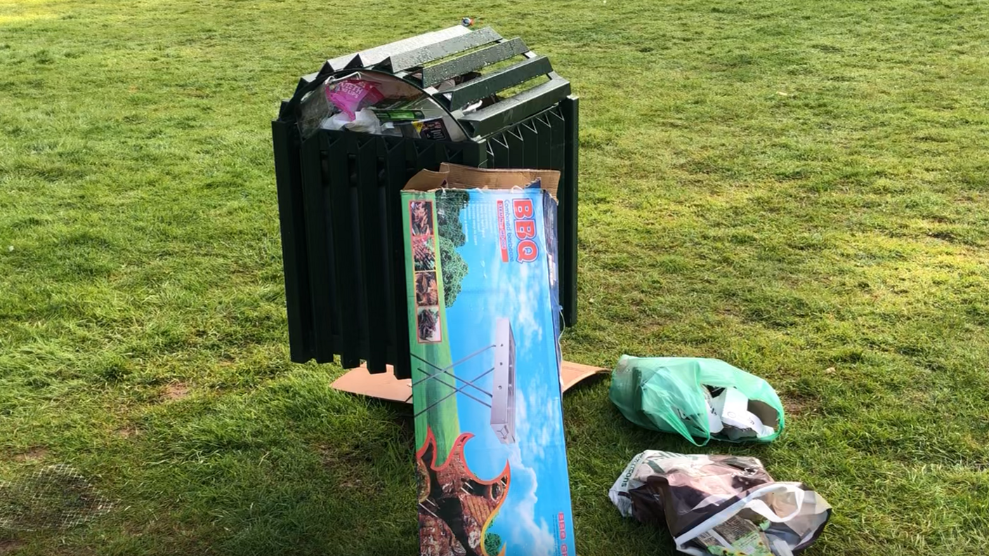 Rubbish left near a bin at Needham Lakes