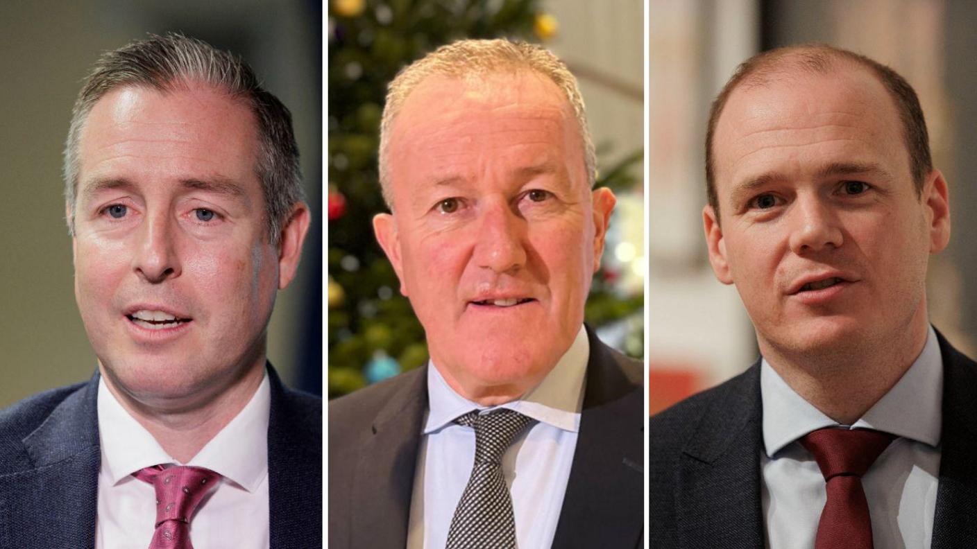 Stormont ministers Paul Givan, Conor Murphy and Gordon Lyons.
Givan, who has spiky brown hair, wears a blue suit and plum coloured tie, Murphy has short grey hair and wears a grey suit and spotty tie and Lyons has short brown hair, a dark grey suit and maroon tie.
All three have a neutral expression.