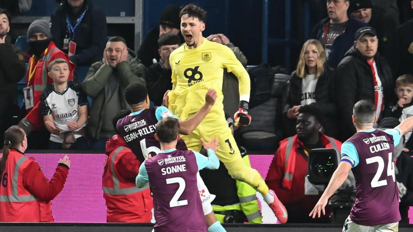 James Trafford celebrates his late penalty save