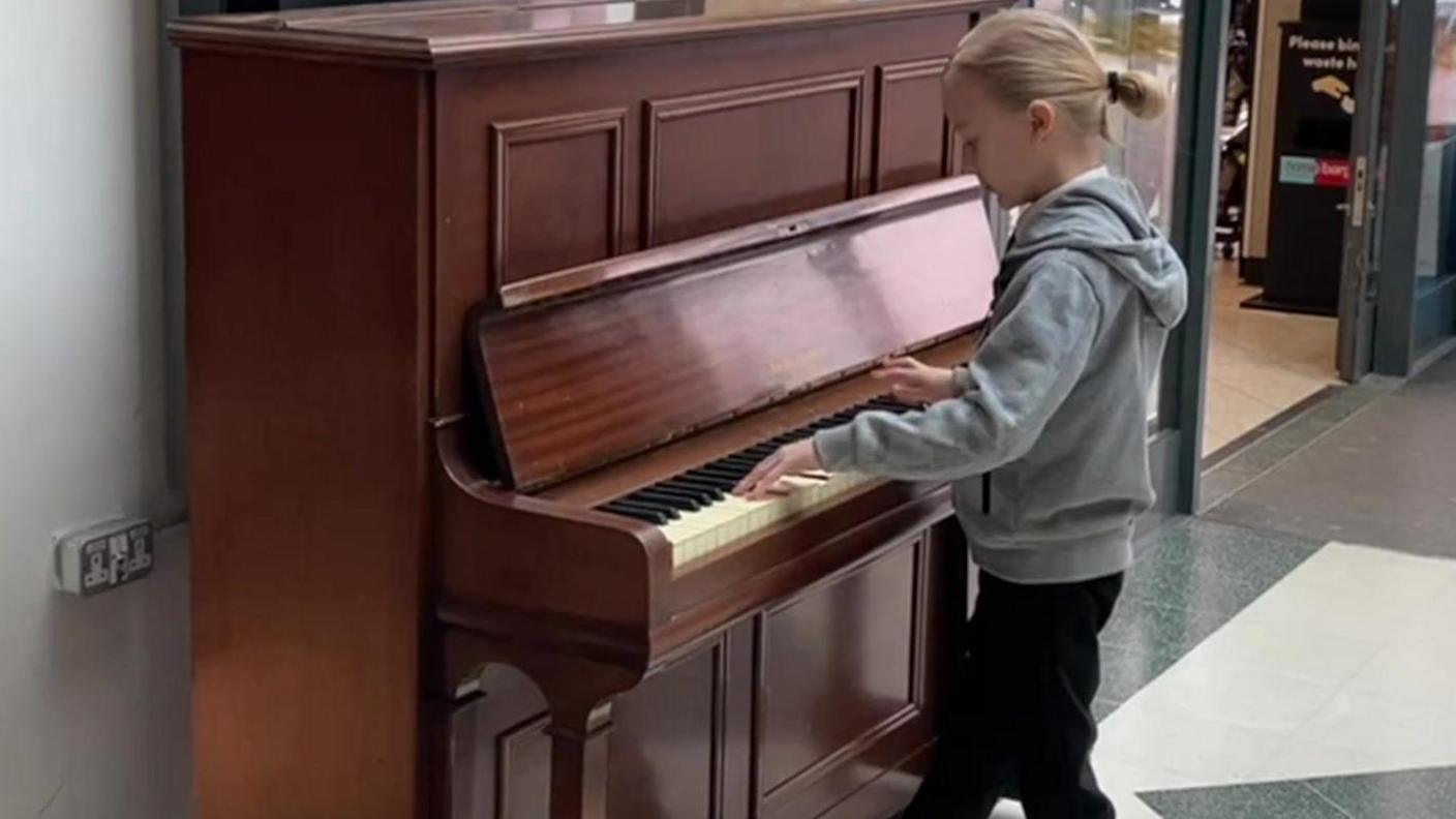 Young boy playing piano