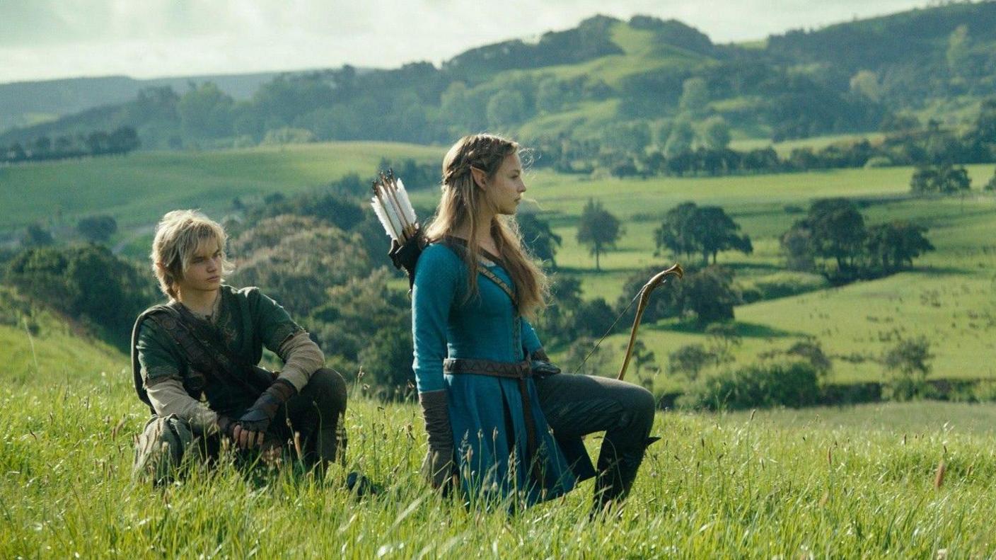 Link and Zelda in the new live action movie kneeling in a field