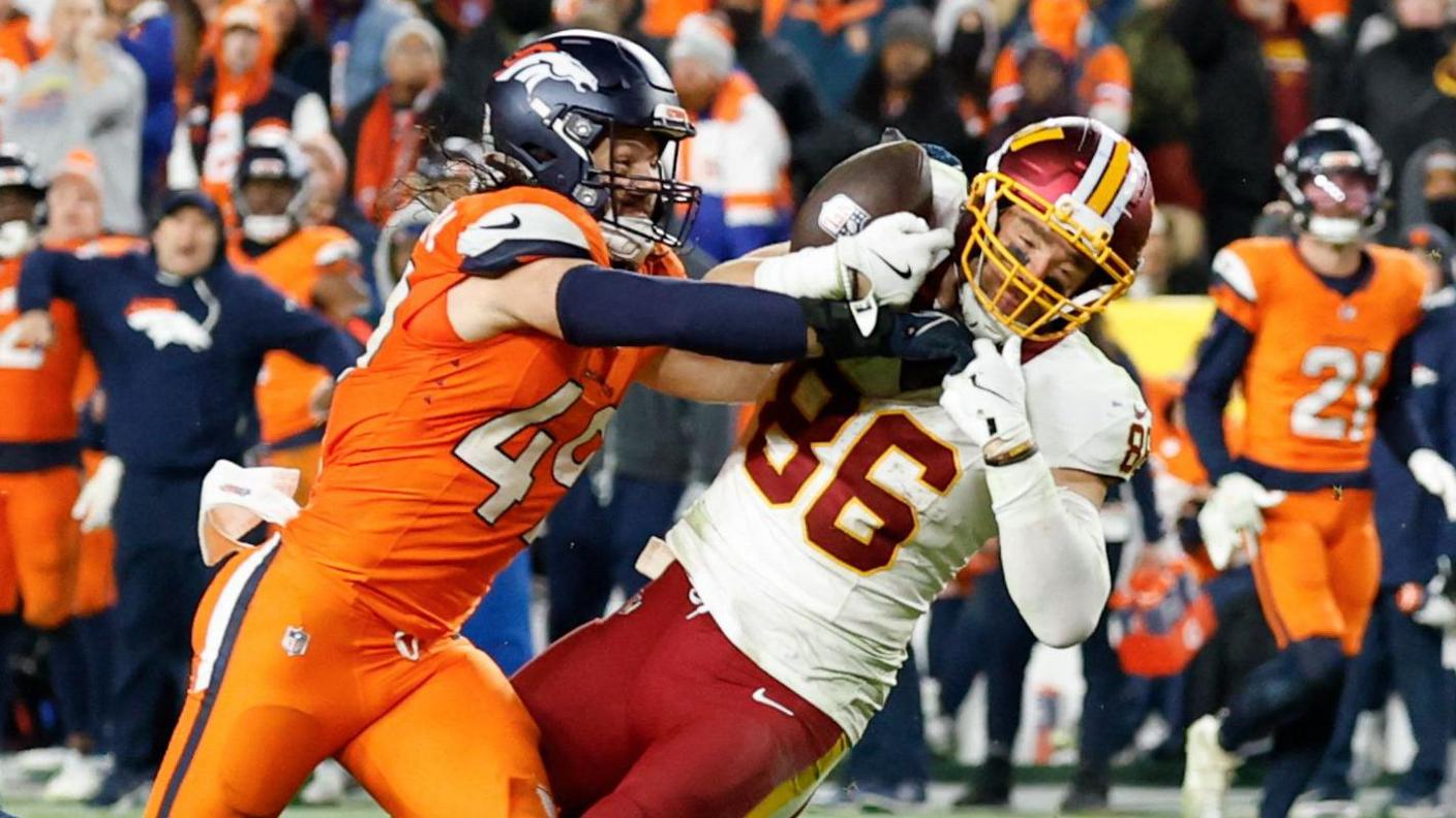 Denver Broncos linebacker Alex Singleton breaks up a pass intended for Washington Commanders tight end Zach Ertz