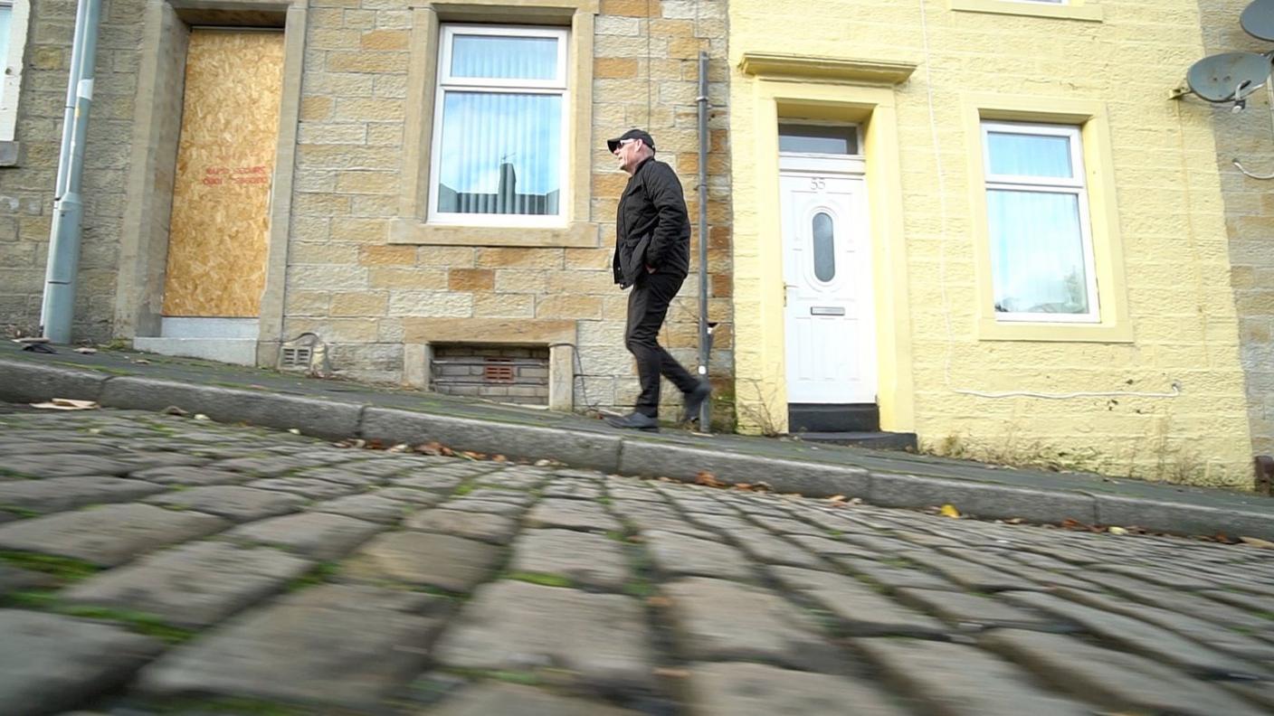 Pastor Mick Fleming on a Burnley street