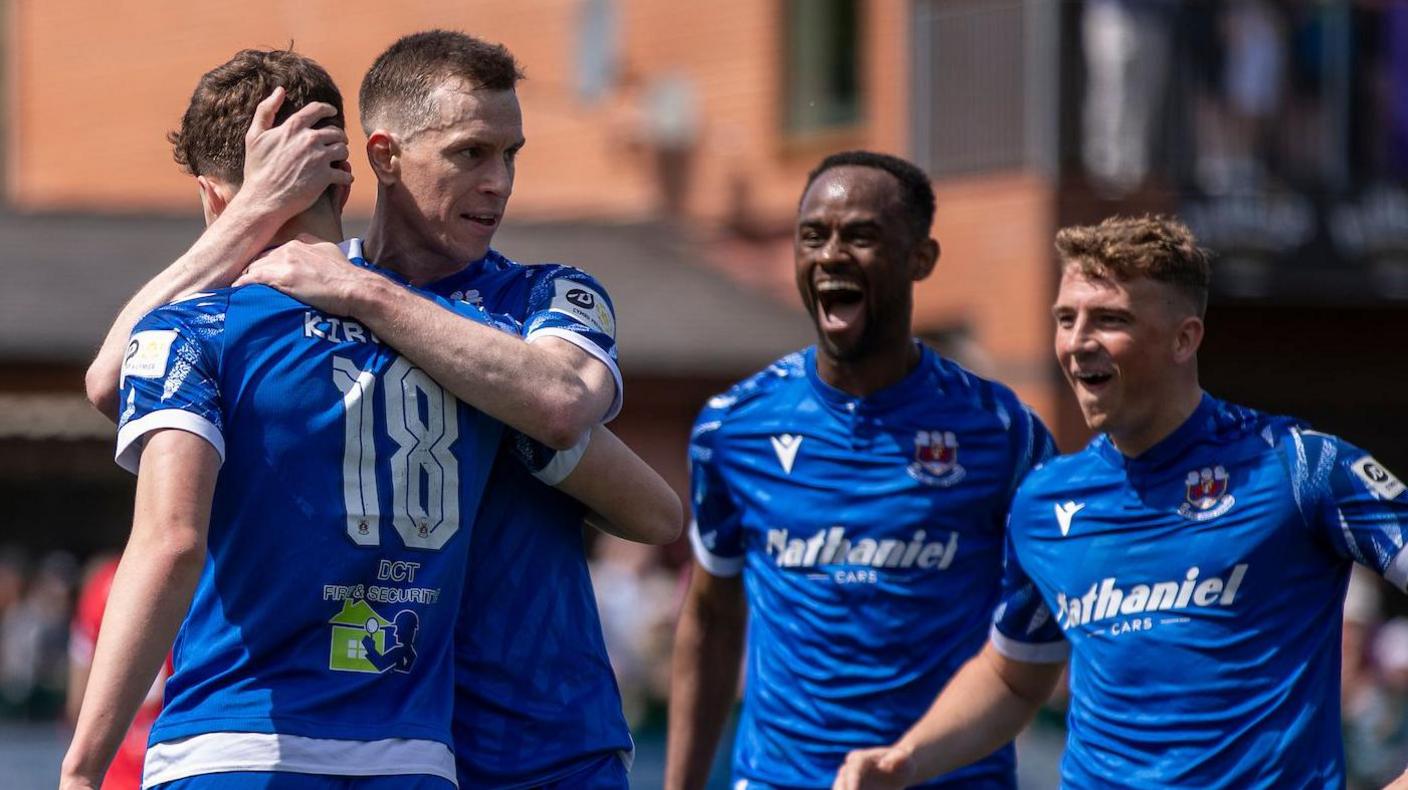 Gabe Kircough is congratulated by Chris Venables