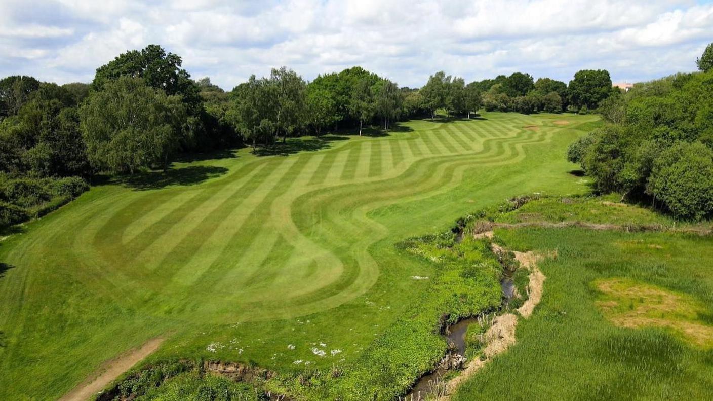 A bird's eye view of the Oxford Golf Club course on a sunny day.