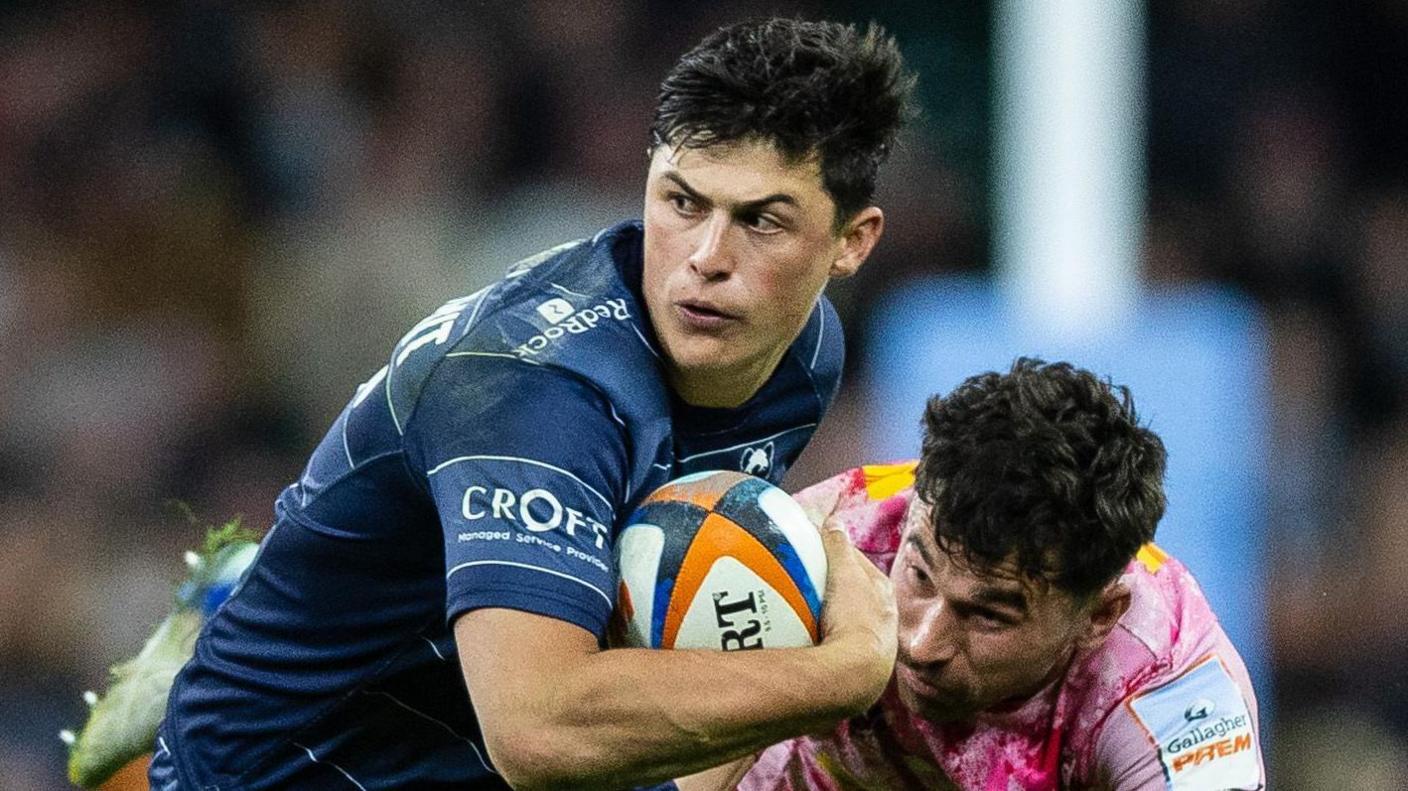 Louis Rees-Zammit breaks out of a tackle for Bristol