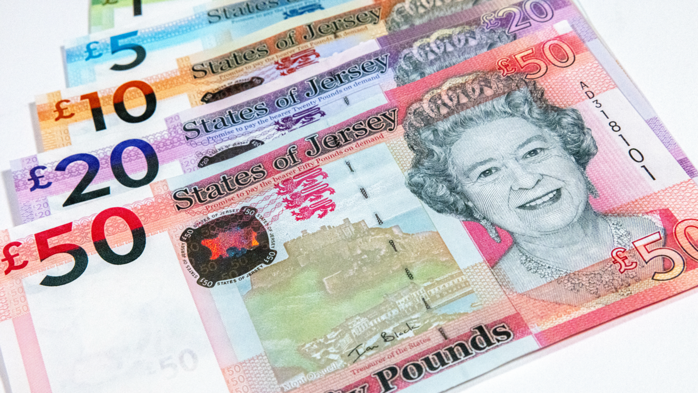 A picture of a number of Jersey notes. There a five notes, one on top of the other. There is a £50, £20, £10, £5 and £1 note.