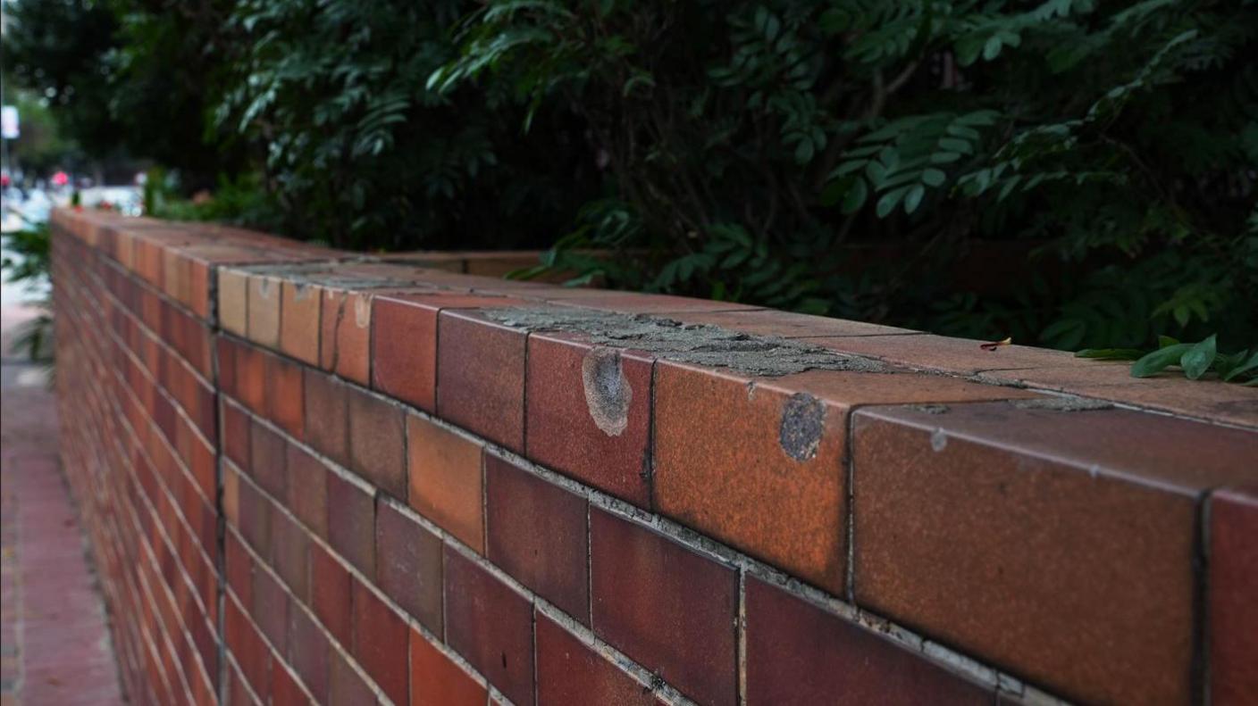 Pockmarked wall at Hong Kong Polytechnic University