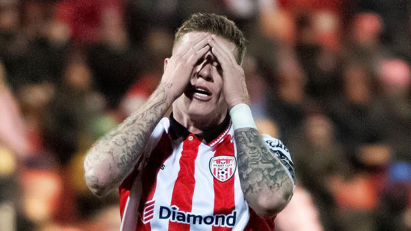 James McClean with his head in his hands 