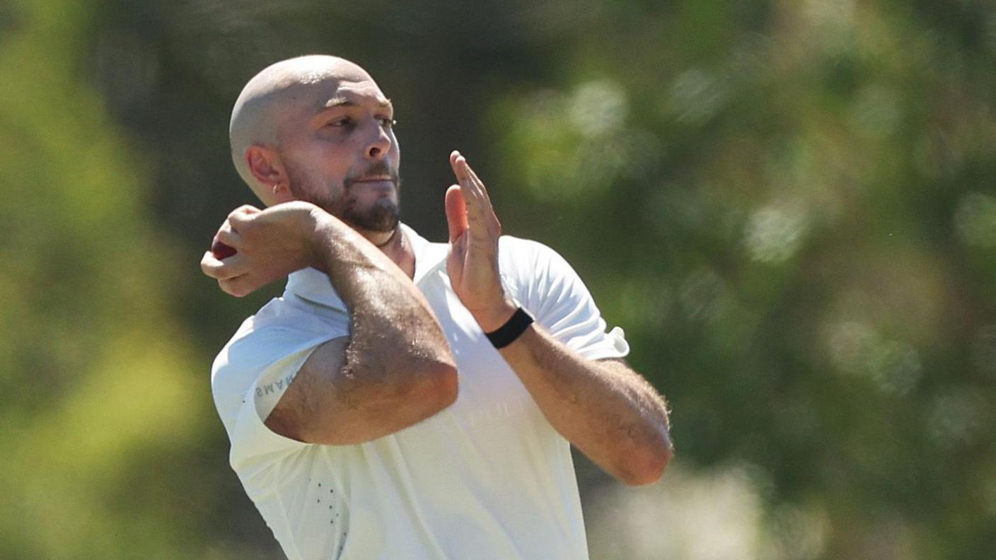 Gabe Bell bowling for Tasmania