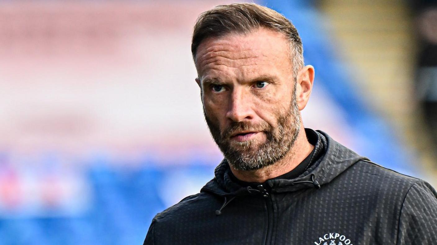 Ian Evatt looks on during his time in charge of Blackpool