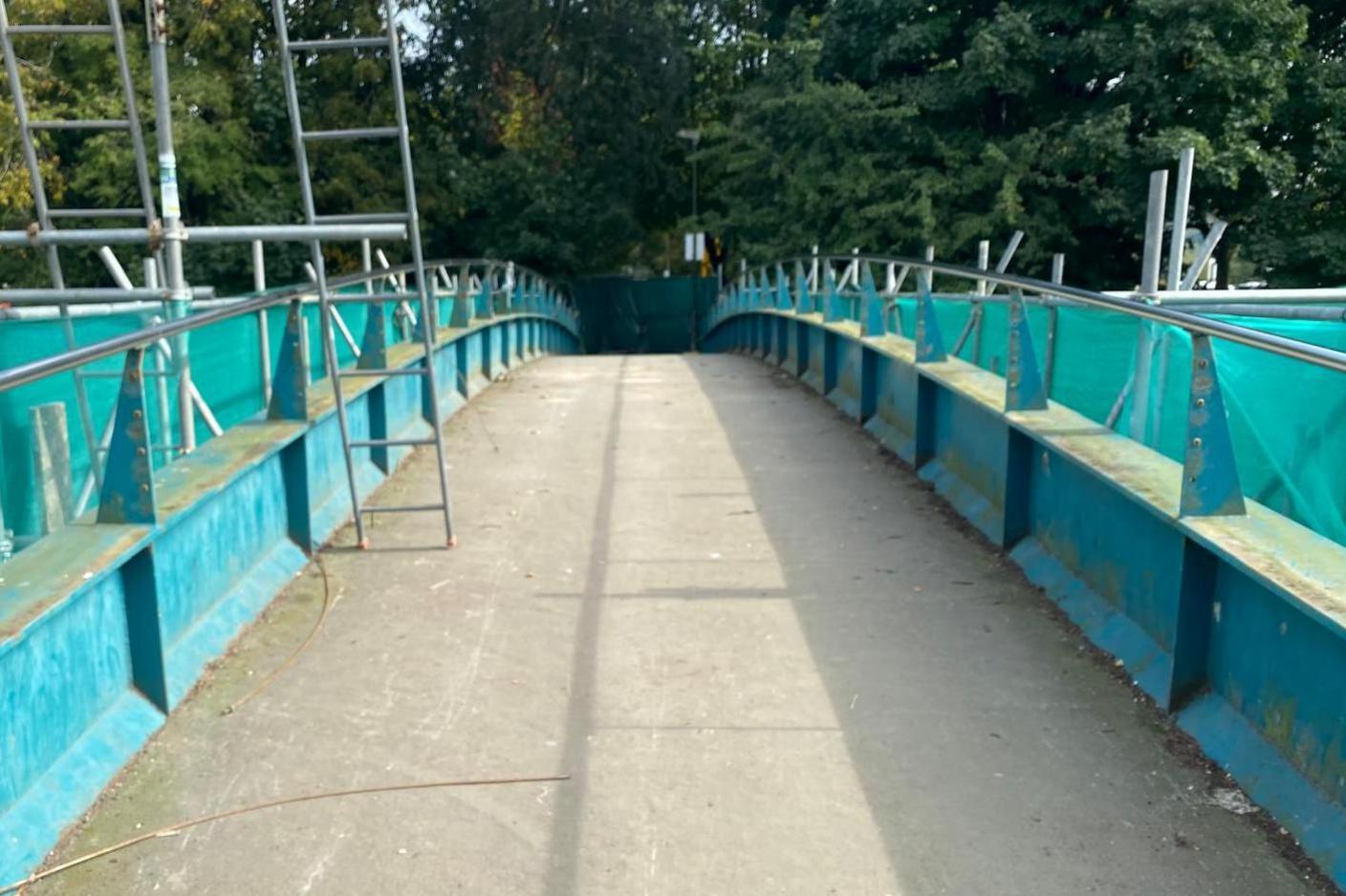 The pedestrian bridge is shown without all of its locks on 25 September