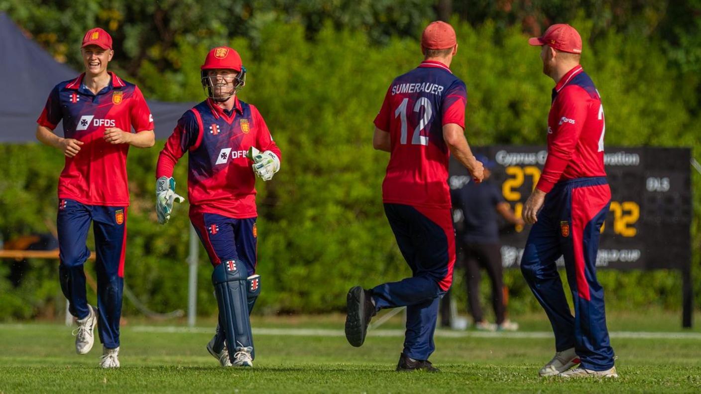 Jersey platers celebrate a wicket against Cyrprus