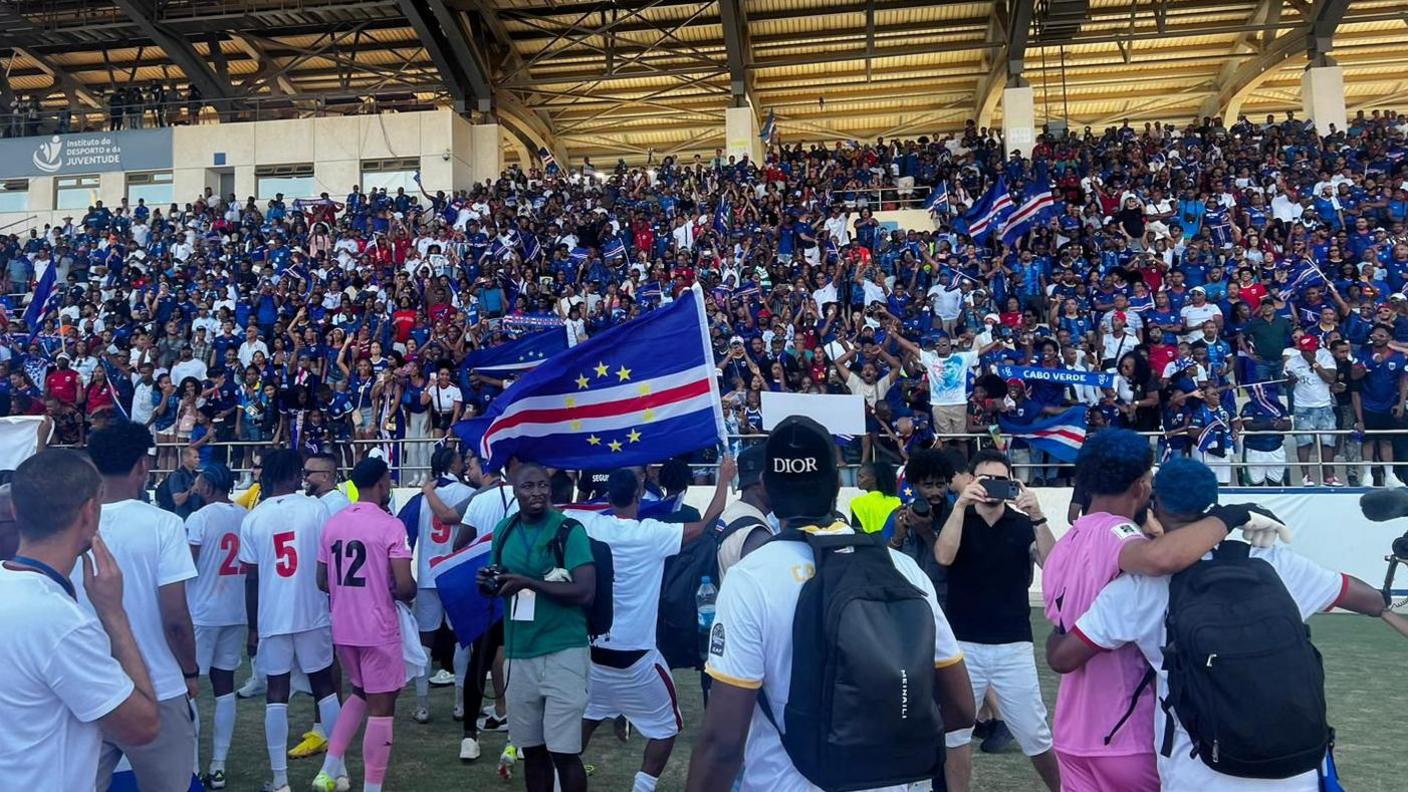 Cape Verde players celebrate in front of a packed stand