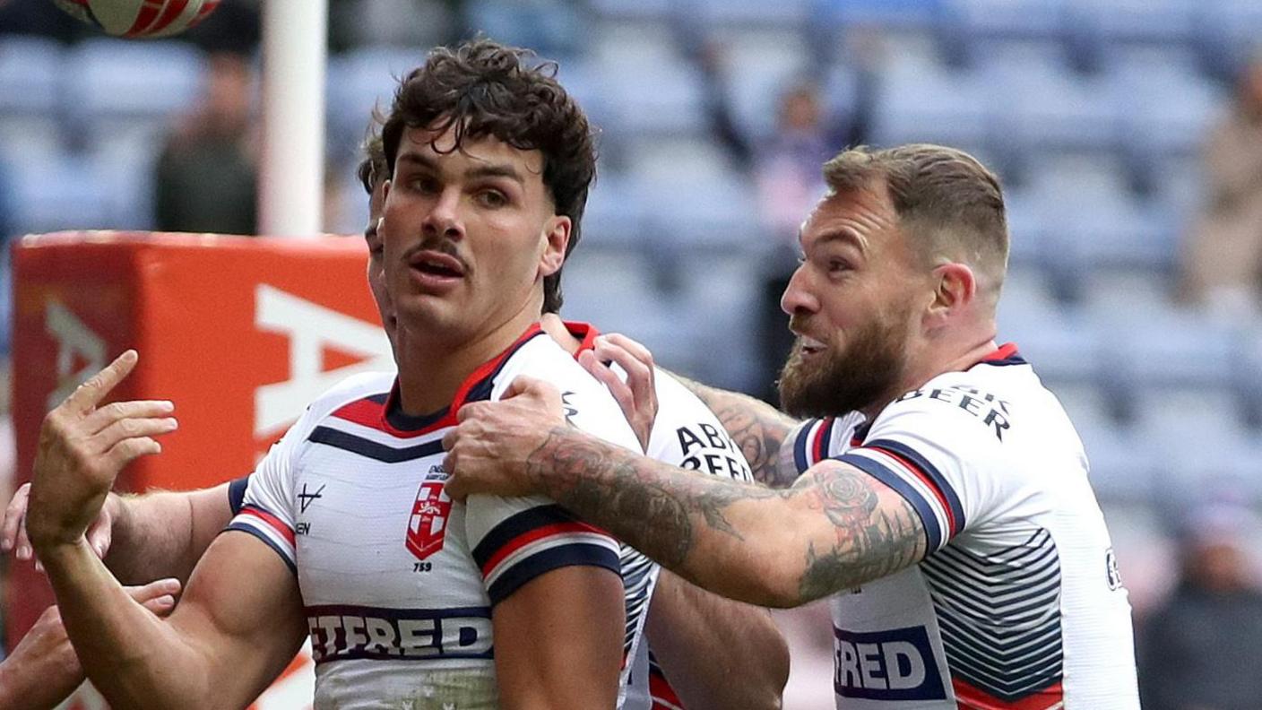 England players celebrate after scoring their first try