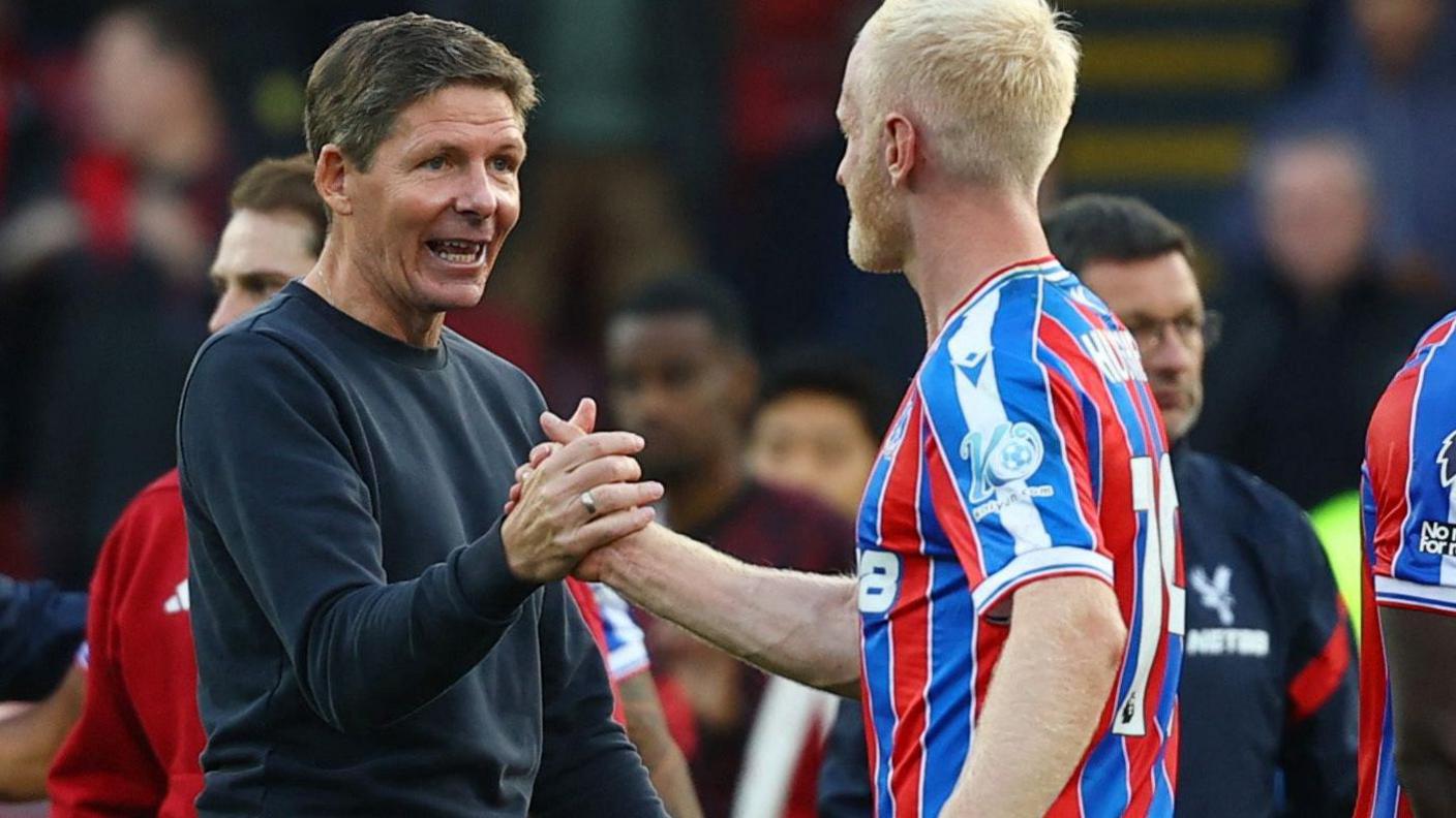 Crystal Palace manager Oliver Glasner congratulates Will Hughes after the win against Liverpool.