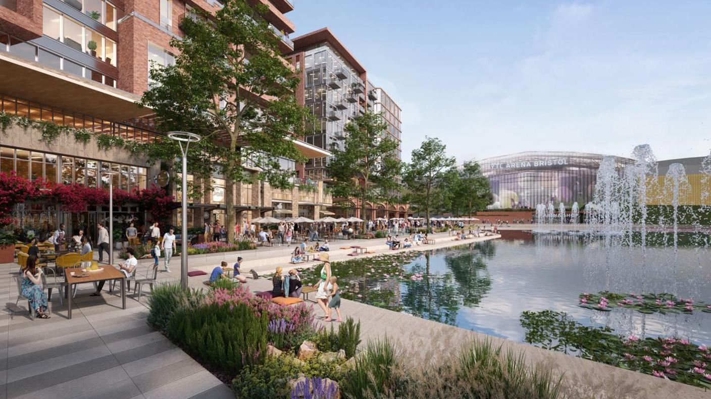 A computer generated image of a large hospitality space surrounding a big lake with water fountains and lily pads floating on the surface. There are people on the concrete promenade, sitting at cafe tables outdoors and enjoying the view. There are lots of trees planted around the water, and in the background you can see the YTL Arena.