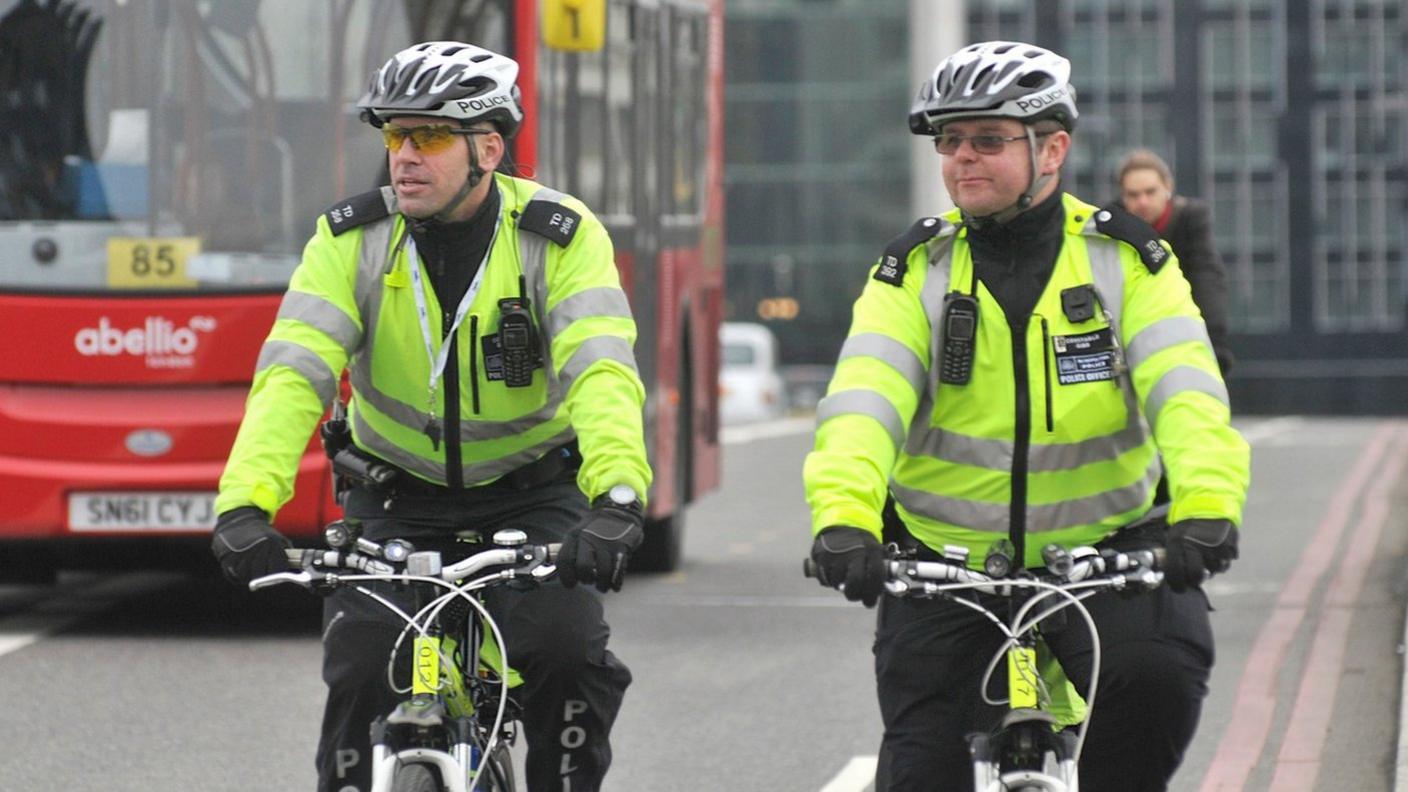 Police with telecoms equipment