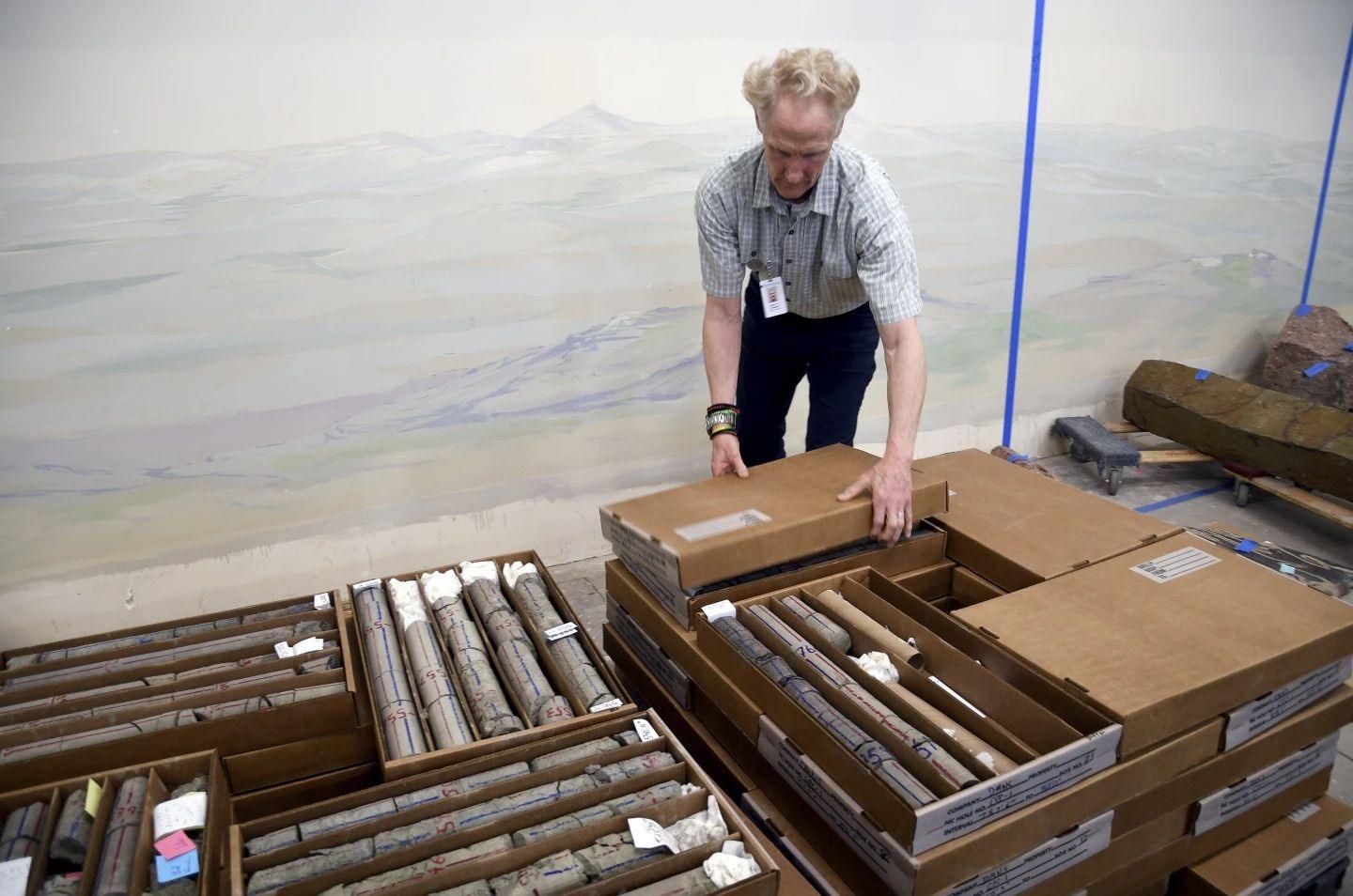 James Hagadorn looking at rock samples from the drilling at the museum