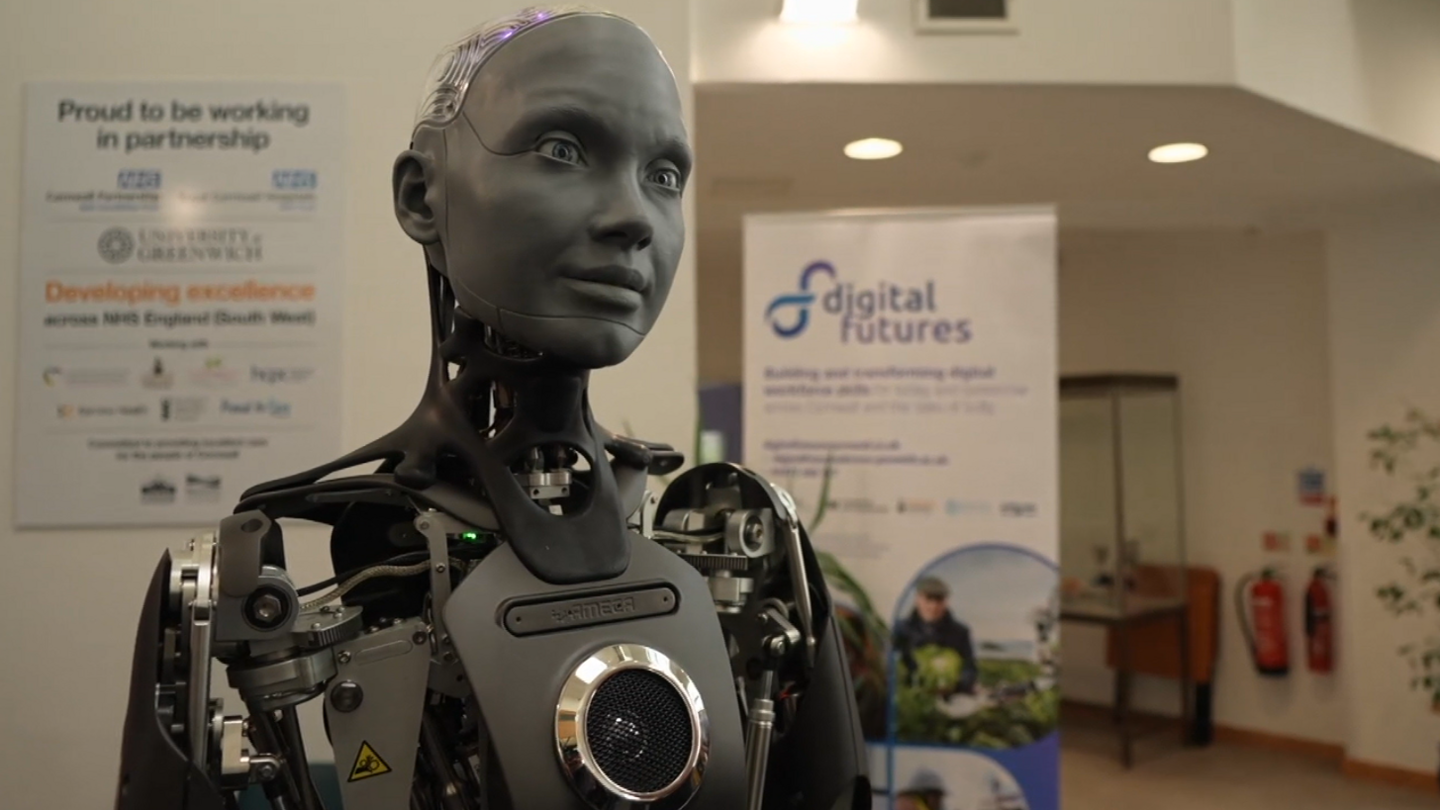 A picture of the black and grey robot at the festival in Cornwall. 