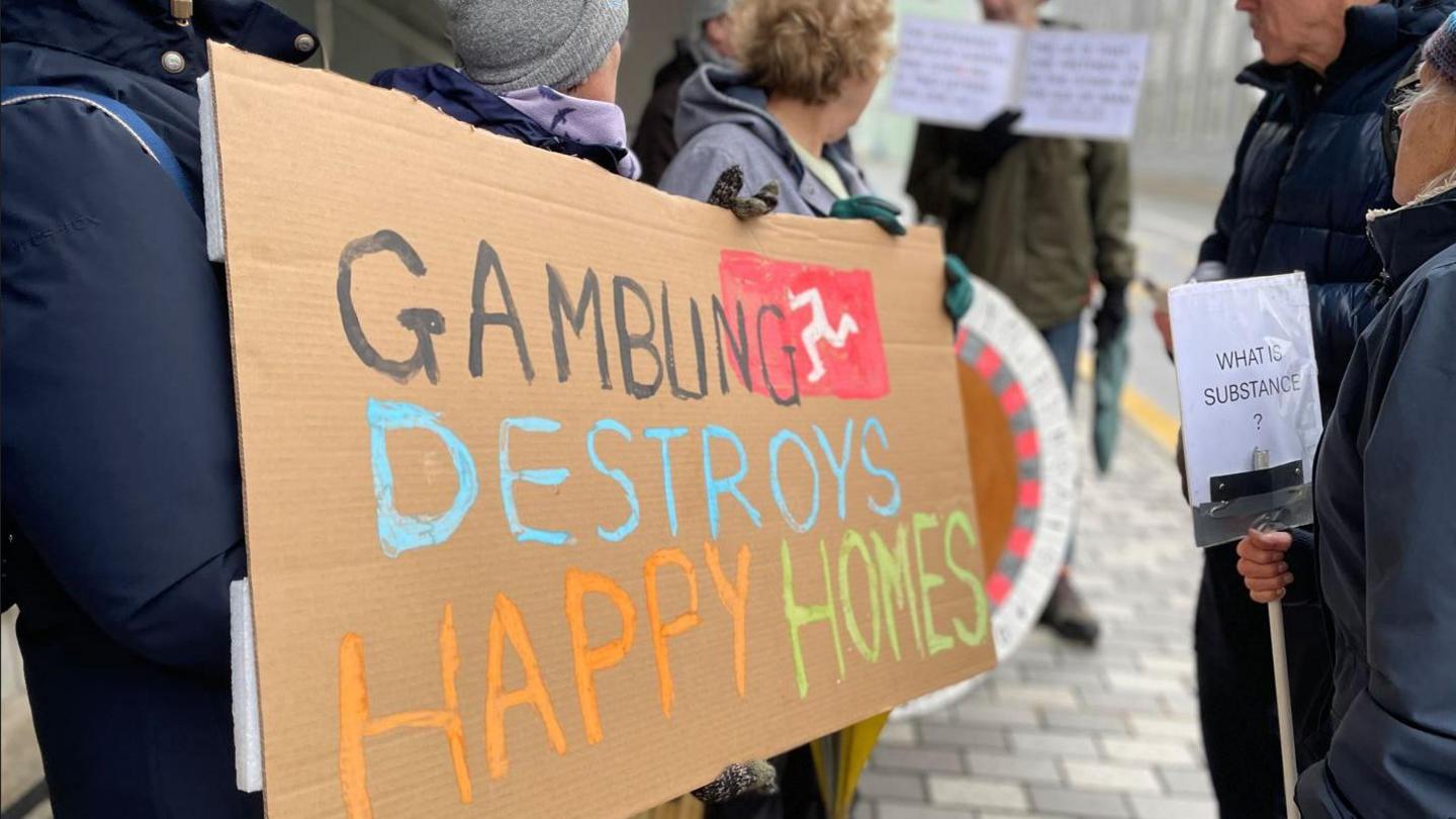 Anti-gambling sign at protest