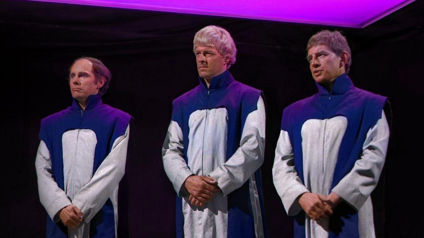 Three Time Lords (Bernard Horsfall, Trevor Martin and Clyde Pollitt) standing in robes looking solemn