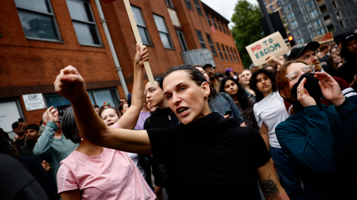 People shout slogans during a counter-demonstration against an anti-immigration protest called by far-right activists in the Walthamstow suburb of London 