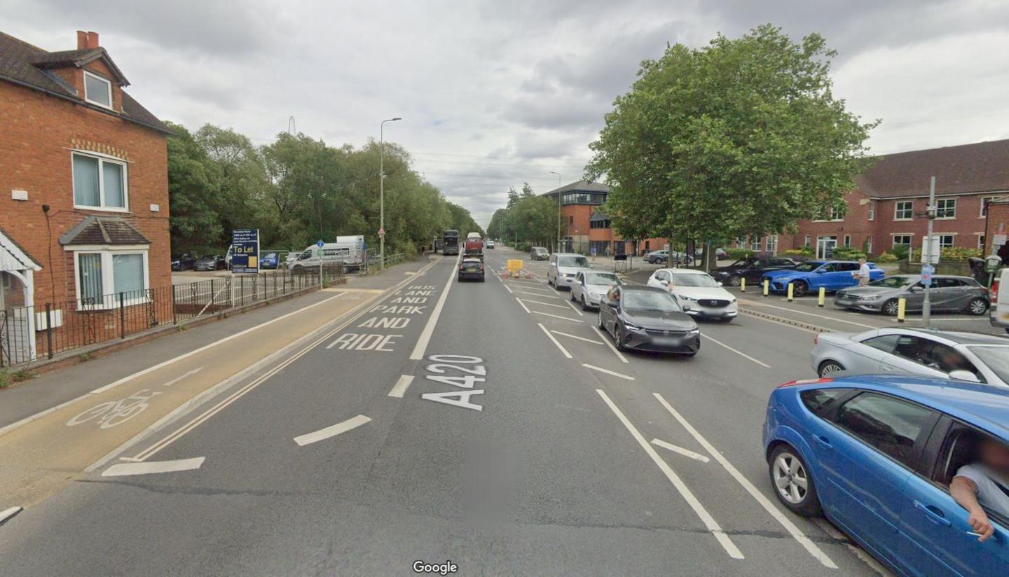 West Way in Oxford. It is a long, wide 20mph road, with a bus lane on the left hand side and a small space to separate the opposite carriageway. There is a cycle lane on the left hand side of the bus lane. 