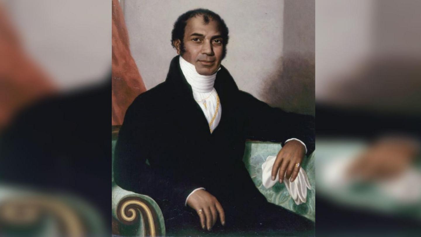 A smartly dressed man in period clothing.