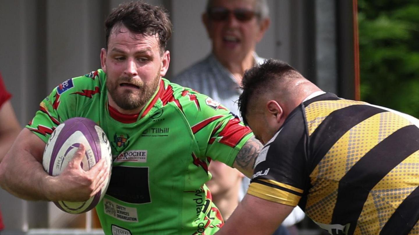 Rhodri Jones of Llandovery races into the corner to score