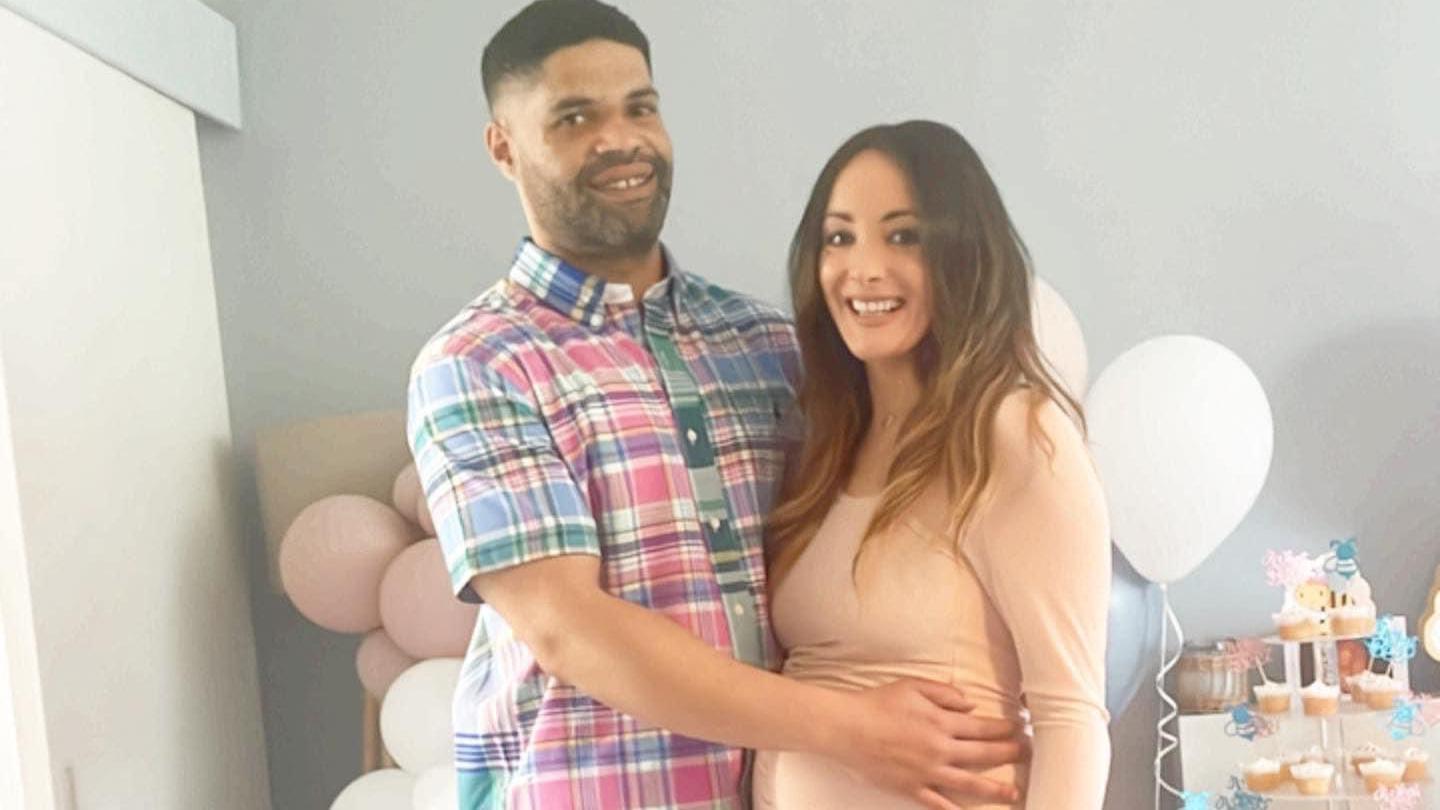 Calvin Buckley with pregnant Frankie Jules-Hough at a baby shower.