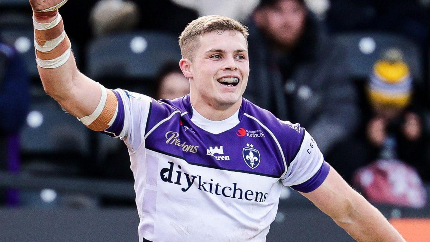 Cameron Scott celebrates scoring a try for Wakefield