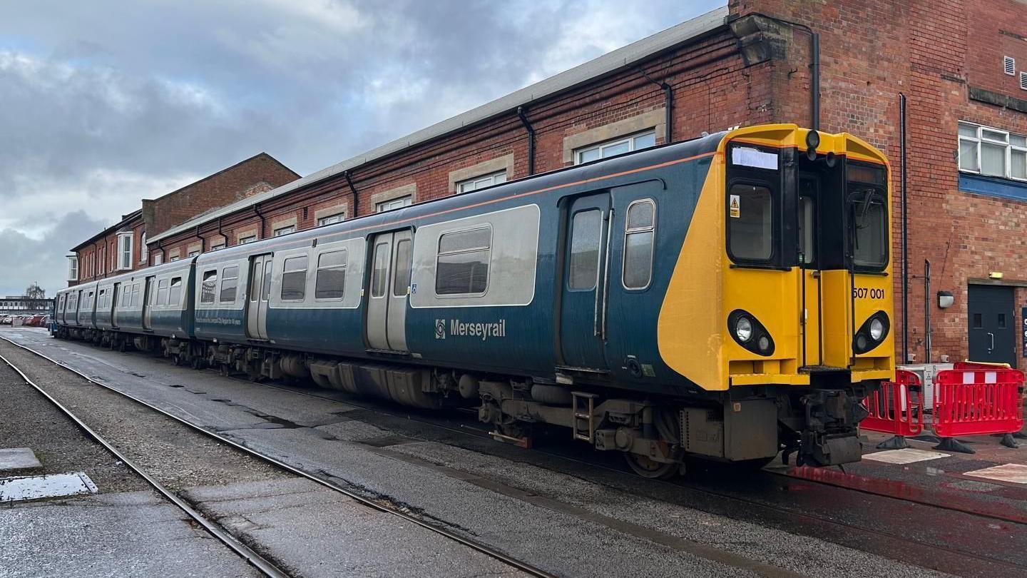 A preserved Merseyrail Class 507 in the Alstom train yard