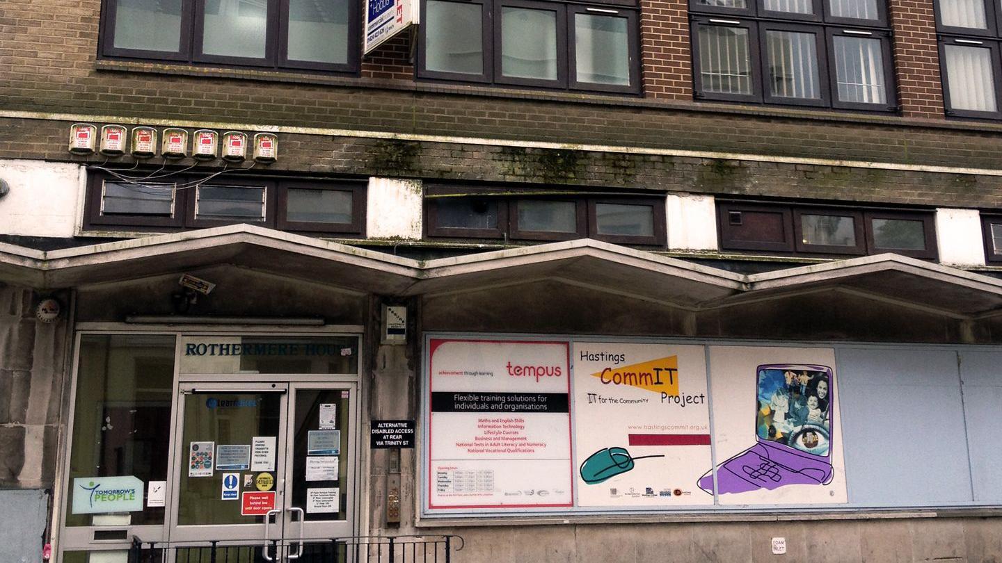 An image of the front of Rock House in 2014 when it was rundown with damp and dirt visible on the bricks and roof over the front door.