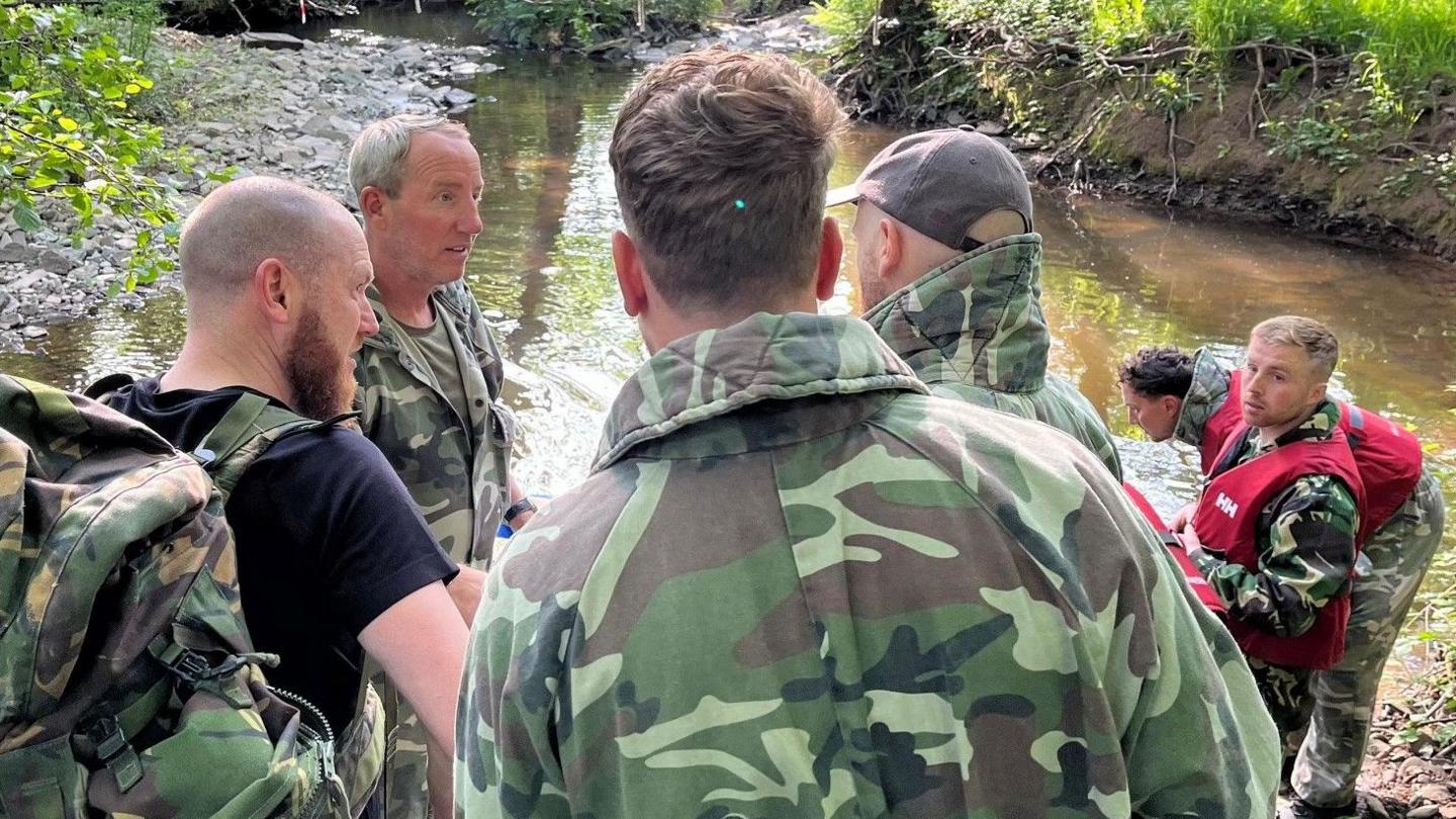 Lee Bowyer (second left) talks to his group during a military exercise as part of the FAW's Uefa pro licence course, while Joe Morrell (right) listens