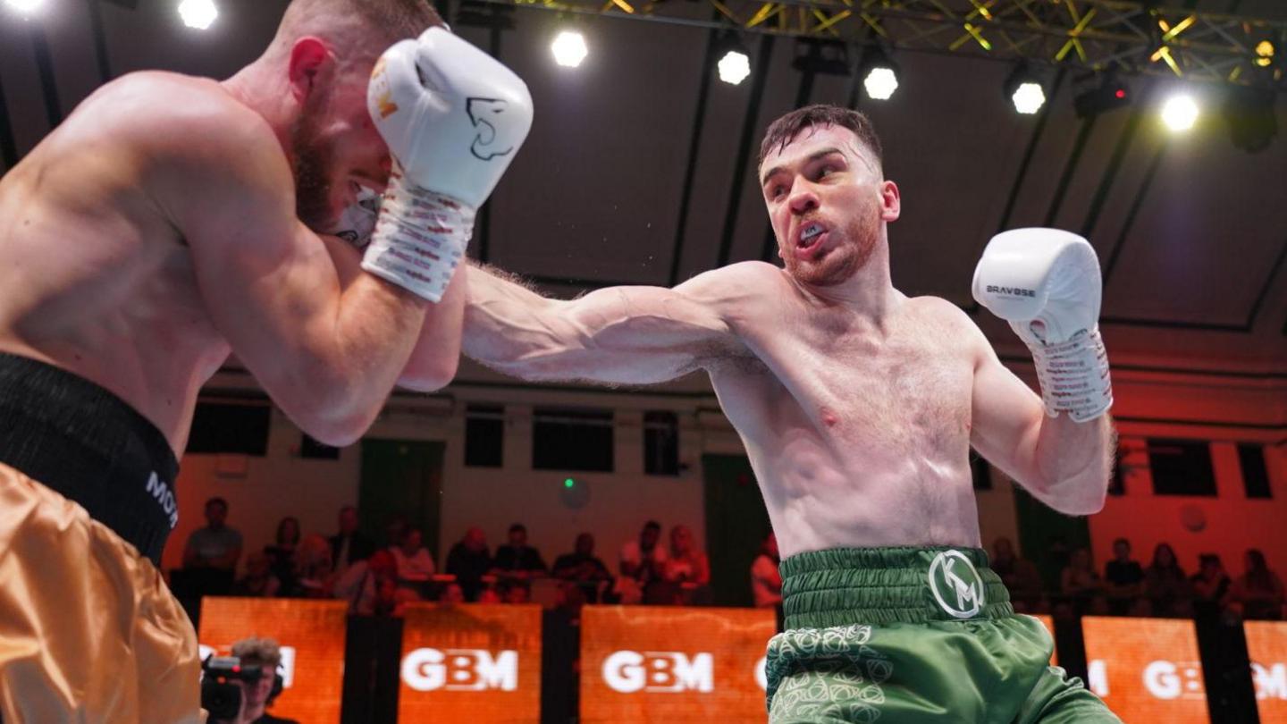 A photo of Kieran Molloy throwing a right hook
