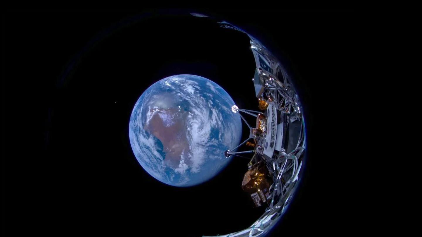 An instrument designed by Canadensys, on the Intuitive Machines' lander in space. Earth is seen below it against a black sky.