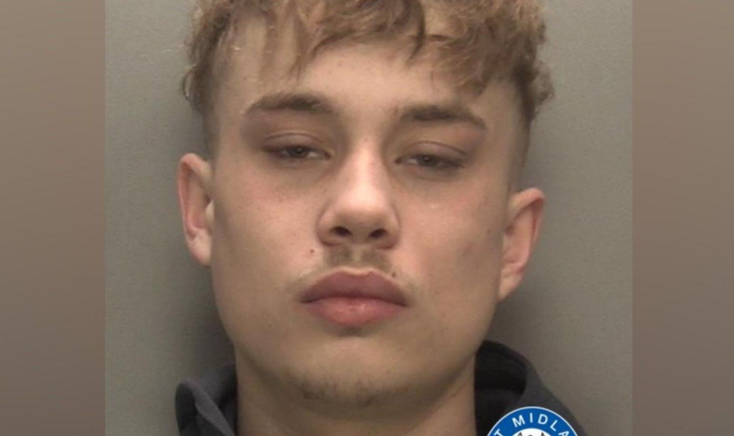 A man with brown hair is looking at the camera in this image from police. Part of the West Midlands force's logo is visible near the bottom right corner.