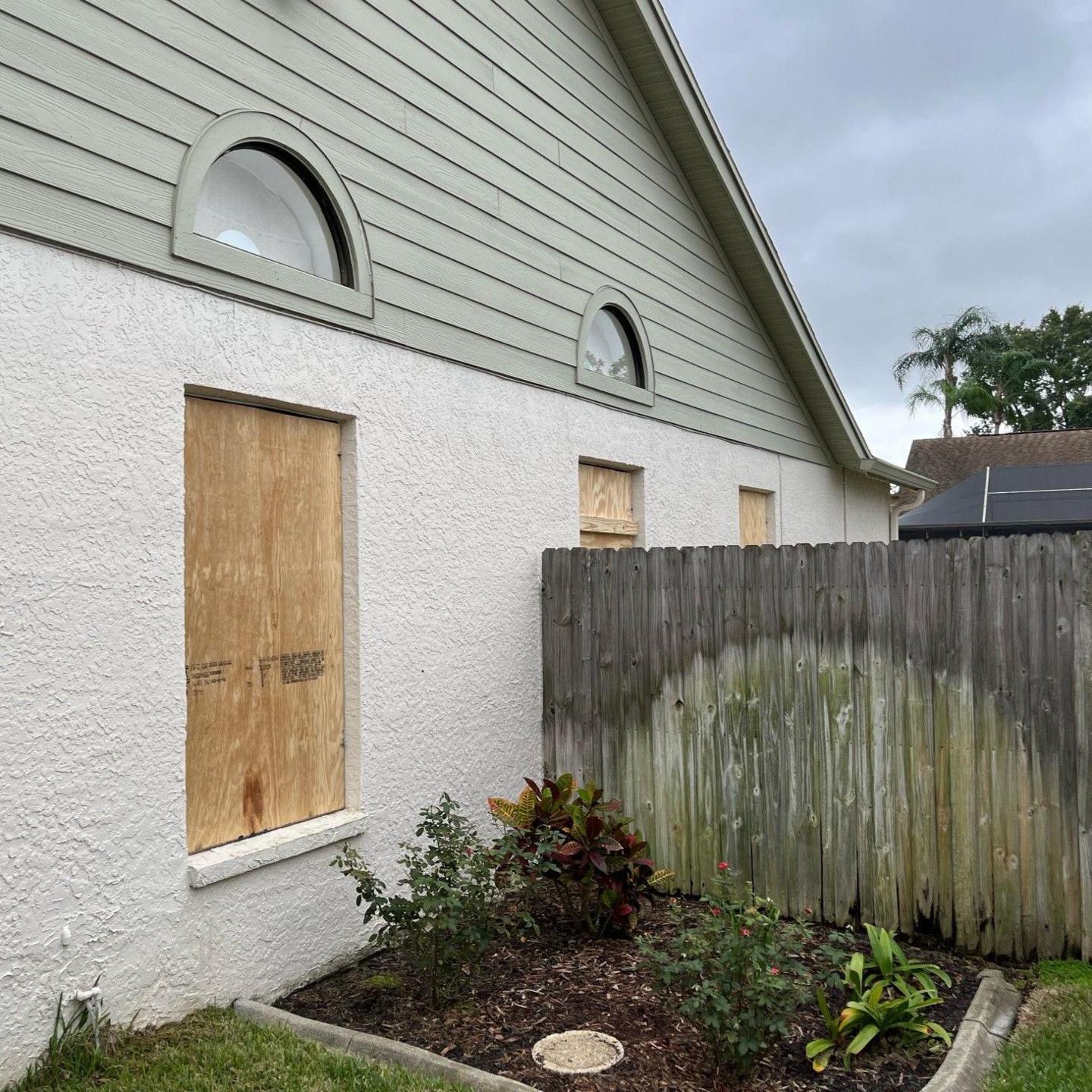 Anne and Sam Frost's home in Tampa, Florida. The windows are boarded up with plywood. 