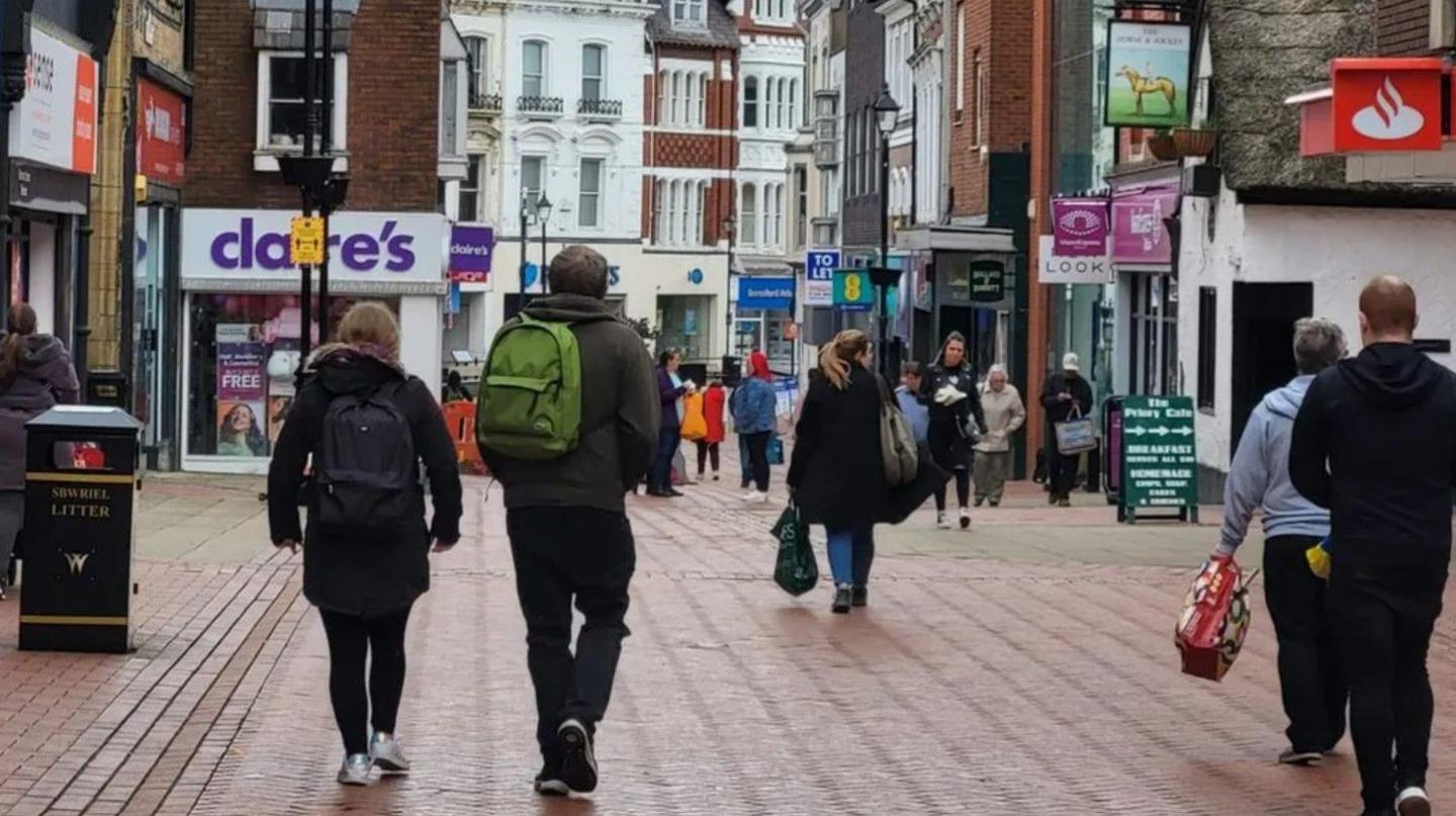 People walking through Wrexham city centre