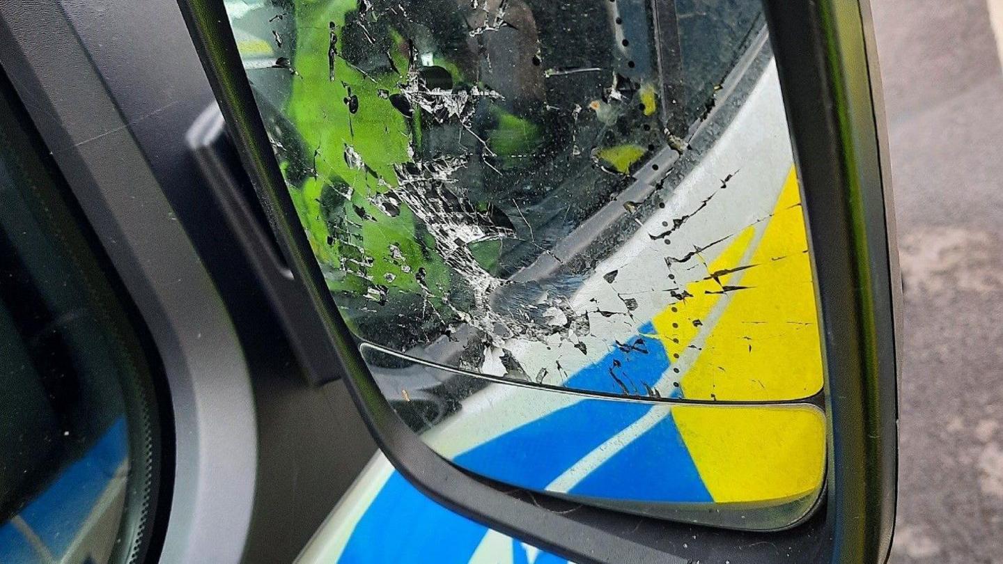 Broken police van wing mirror