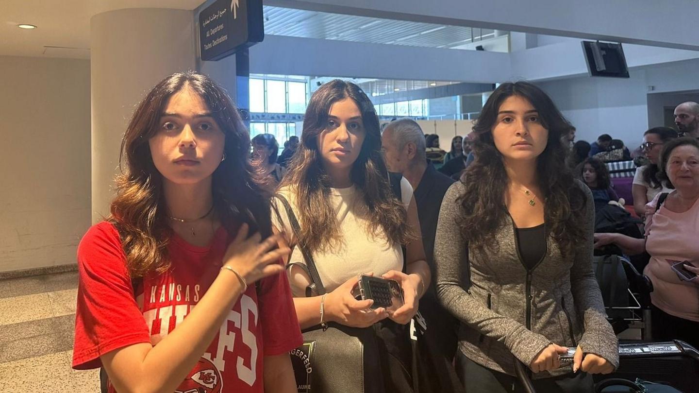 Three young women looking at a camera with sad expressions