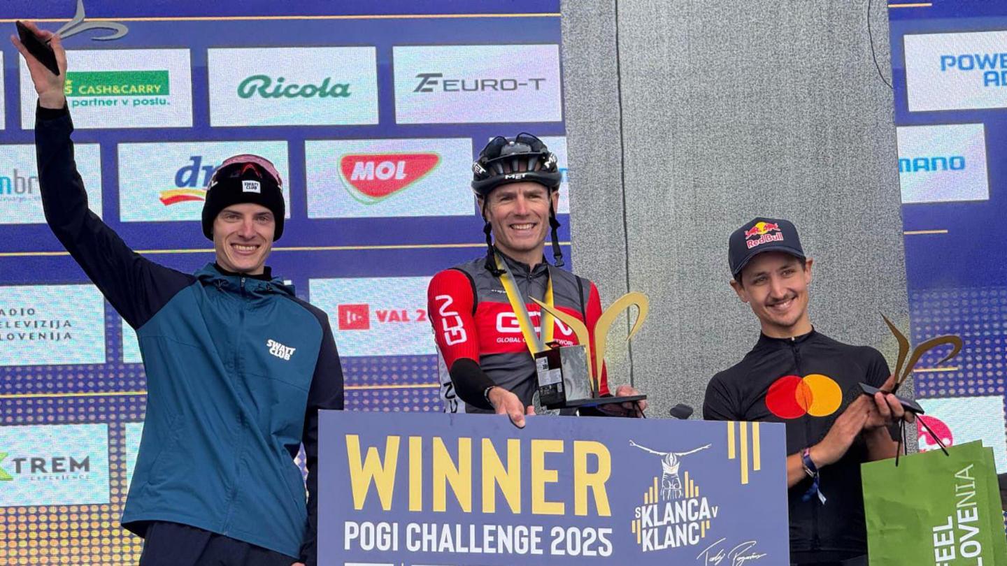 Andrew Feather is pictured on the podium, he is holding a sign which reads "Winner, Pogi Challenge 2025"