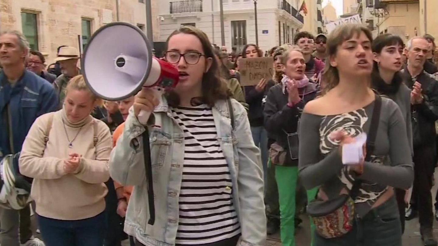 Protesters outside parliament in Valencia called for the regional leader to resign