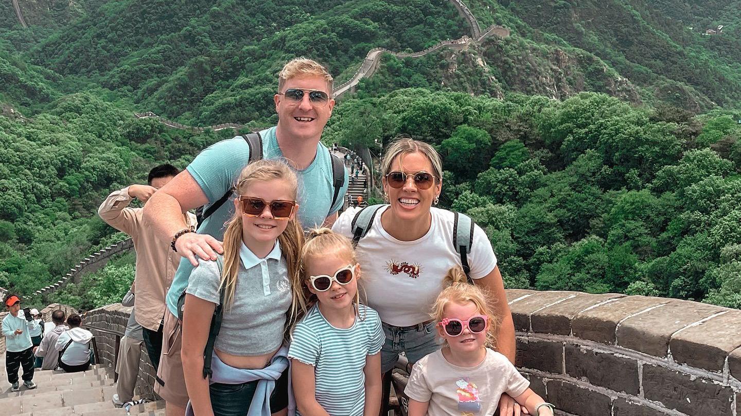 The Hutchinsons stood in front of the Great Wall of China