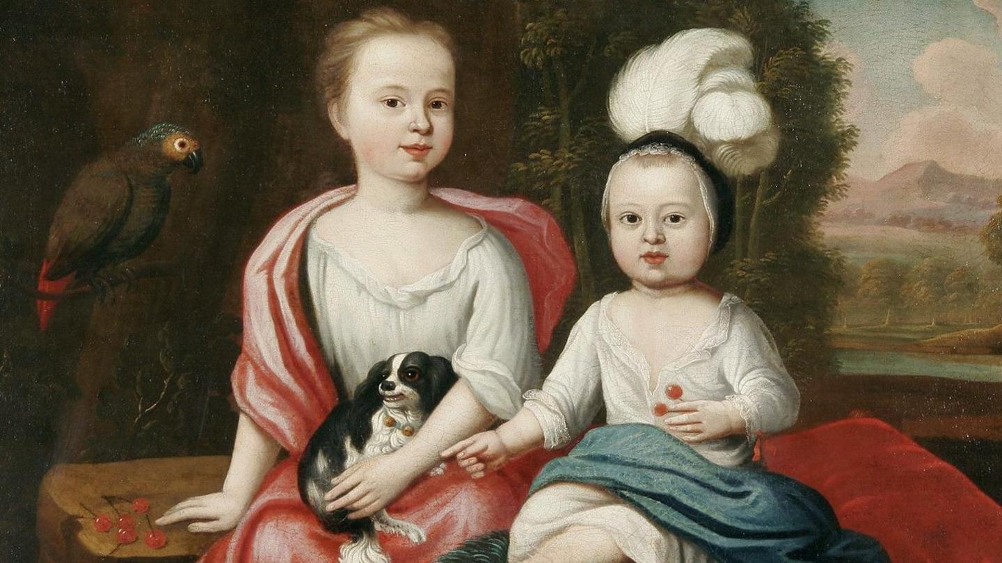 A painting of two children, one is wearing a red shawl and white dress and holding a dog. The other child is wearing a black hat with a feather and a white dress and blue shawl. There is a parrot in the background with greenery.