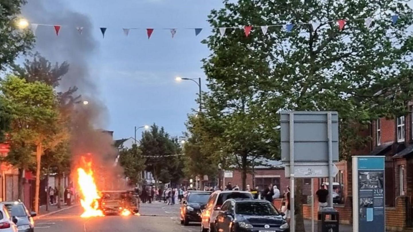 A car which has been set on fire in Belfast