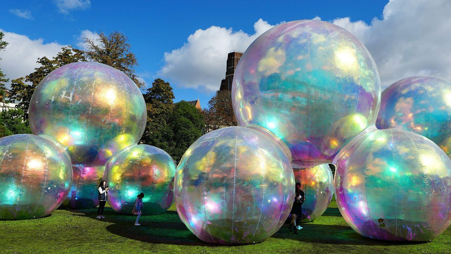 Evanescent by Atelier Sisu, an interactive bubble sculpture with children walking around it