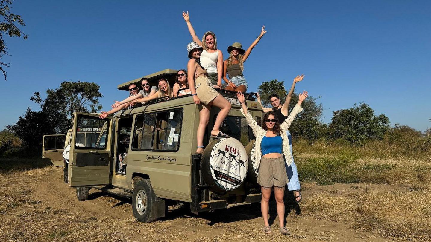 A group of students in a safari jeep at Mikumi National Park