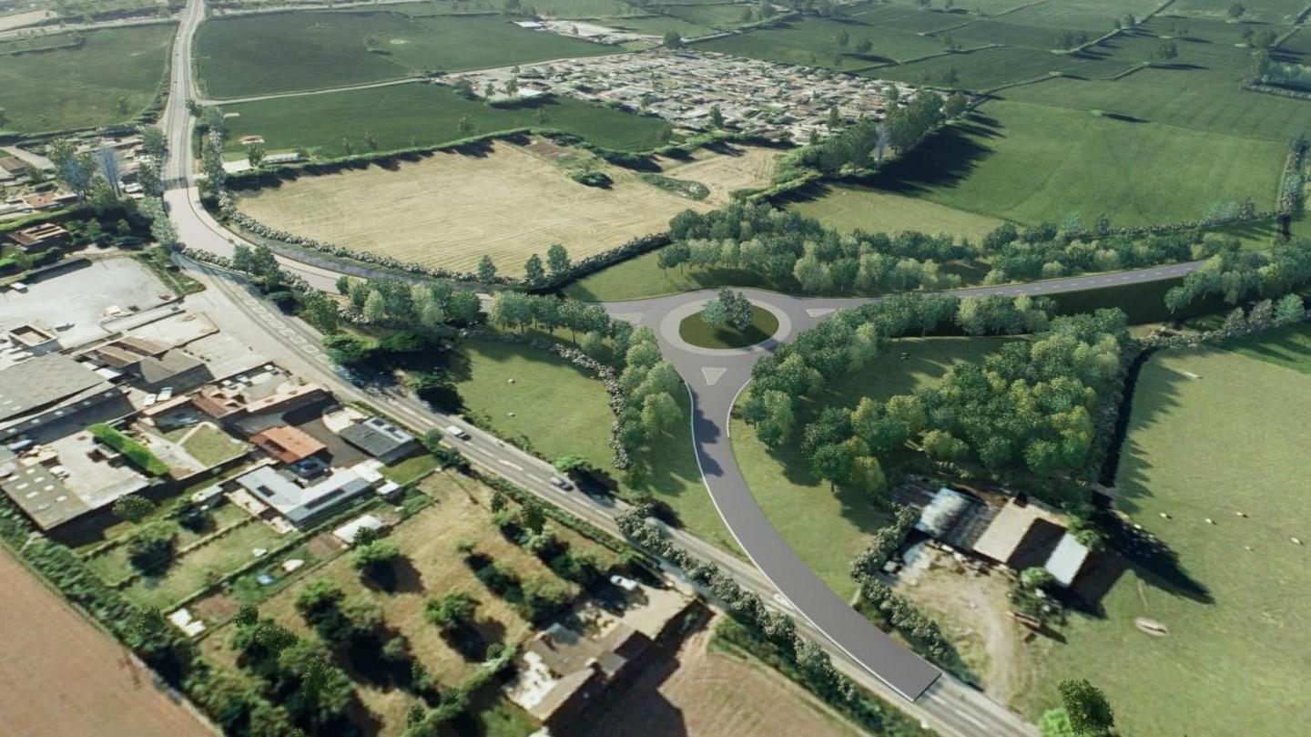 A CGI showing three roads linked by a roundabout running through green fields